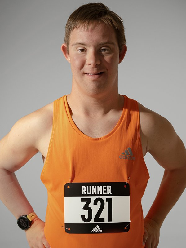 Runner with Down Syndrome posing for the camera.